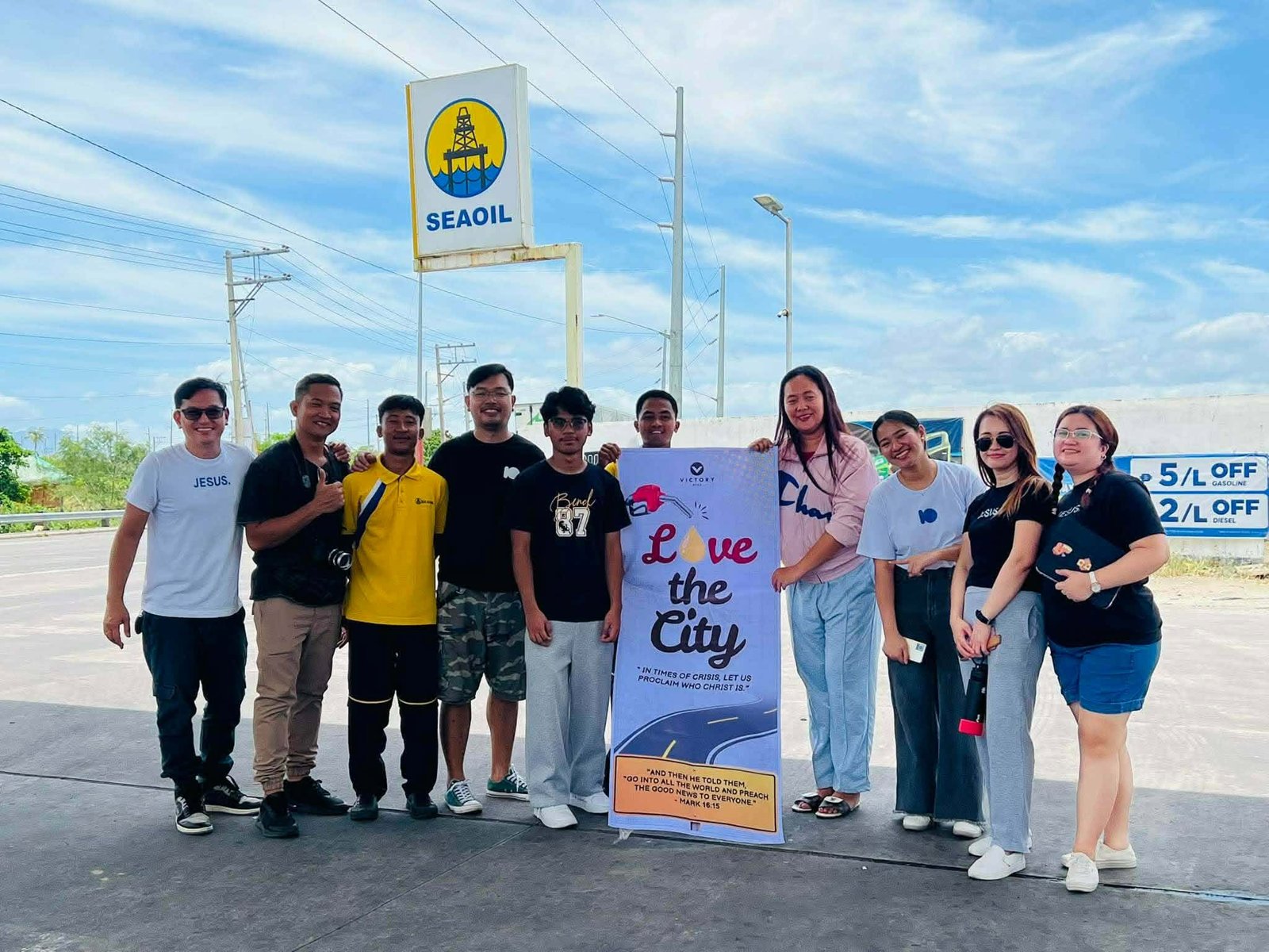 Victory Camarines Sur volunteers holding a Love the City banner